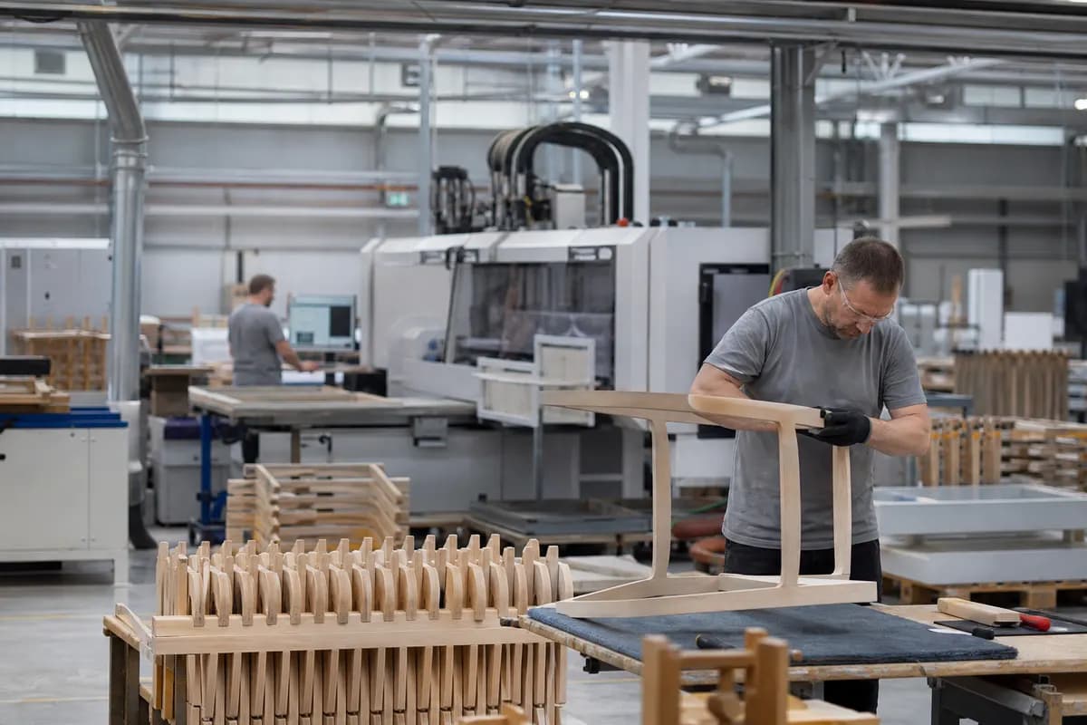 Modern furniture manufacturing facility with wooden and upholstered components